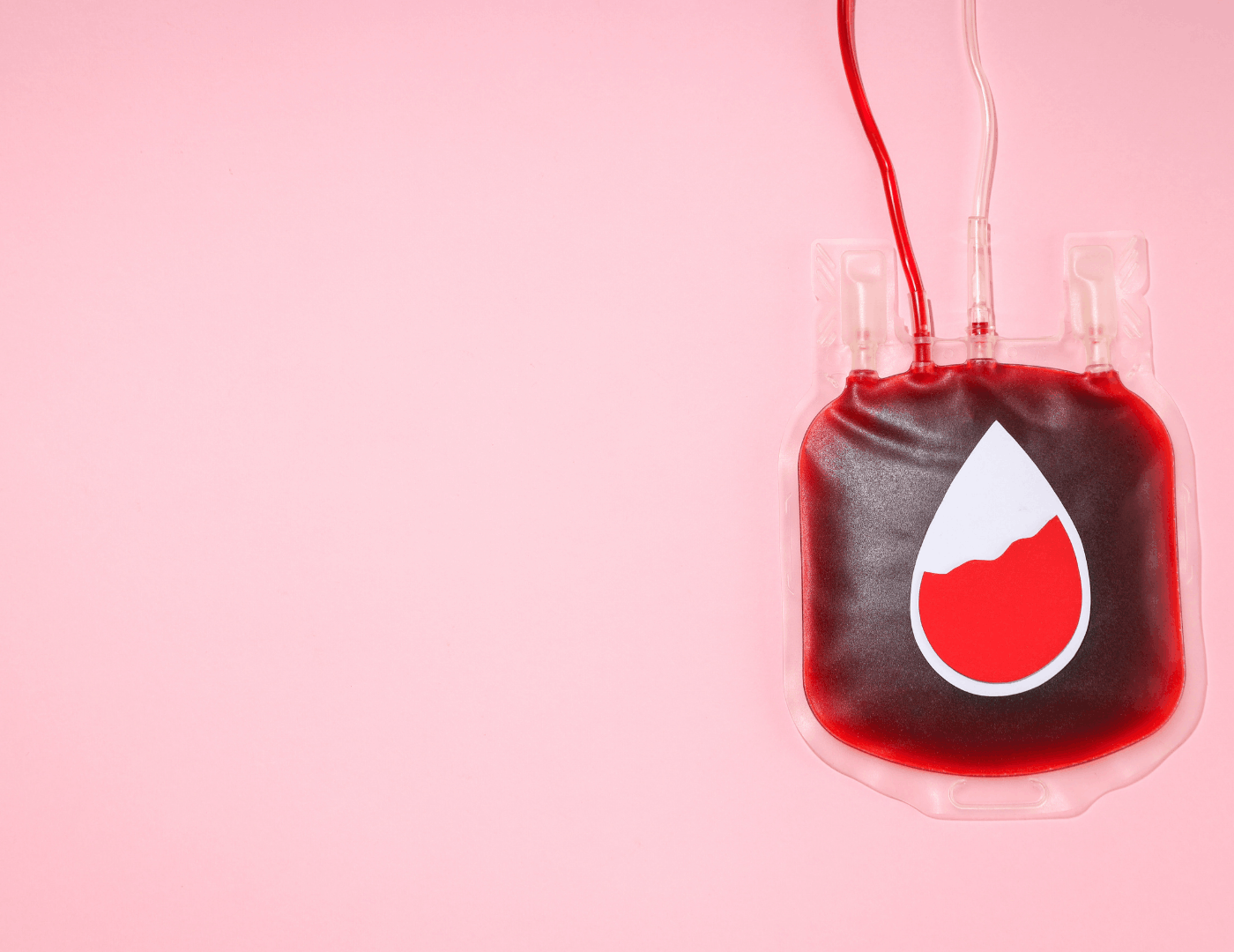 A blood bag on a pink background representing iron demand and blood volume expansion in the second trimester, third trimester and postpartum