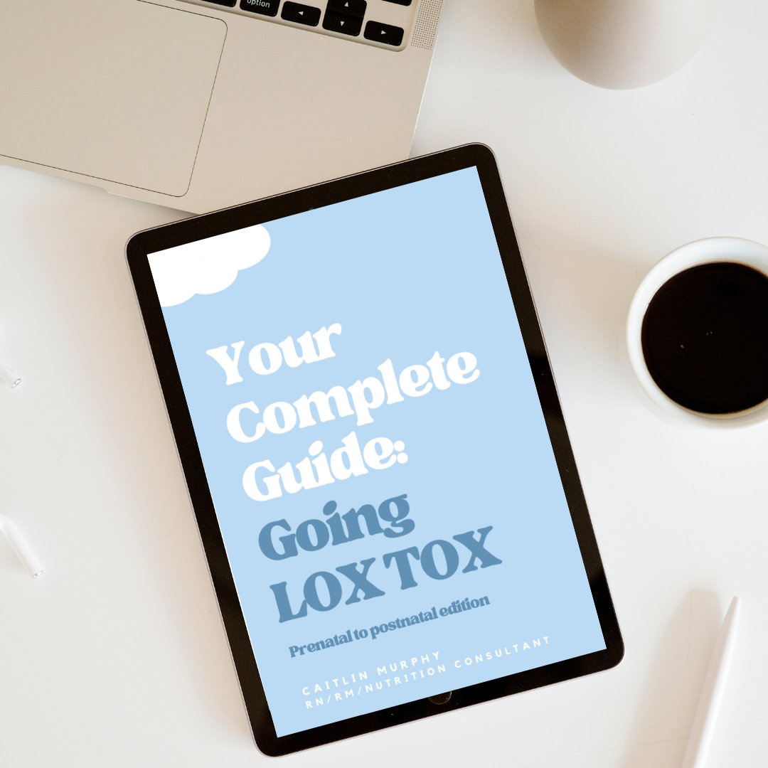 Digital tablet displaying the cover of the eBook “Your Complete Guide: Going Low Tox - Prenatal to postnatal edition” by Caitlin Murphy, placed on a white desk with a cup of black coffee nearby