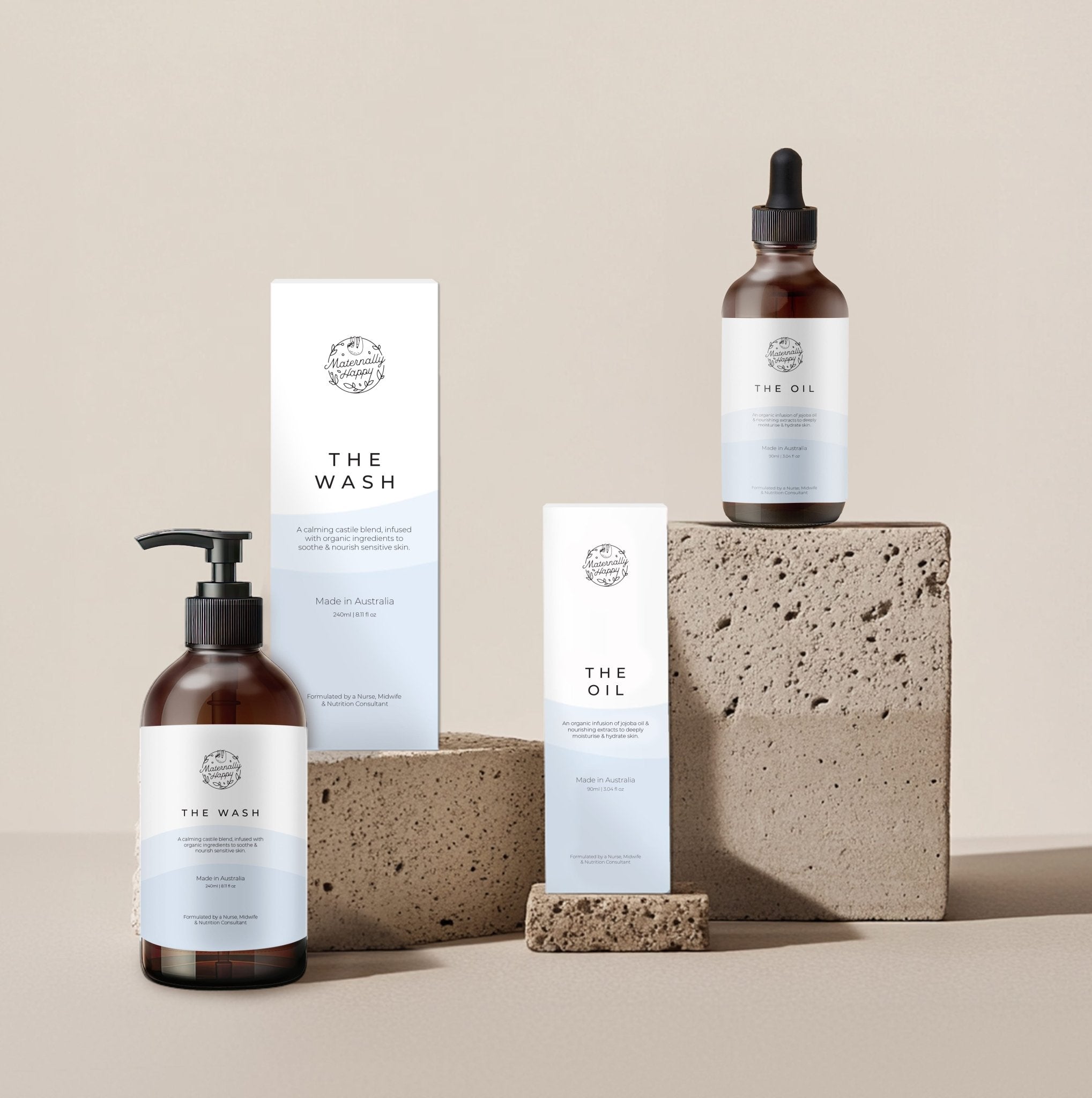 The Natural Skin System – vegan pregnancy and baby skincare – organic body wash and oil set on stone background